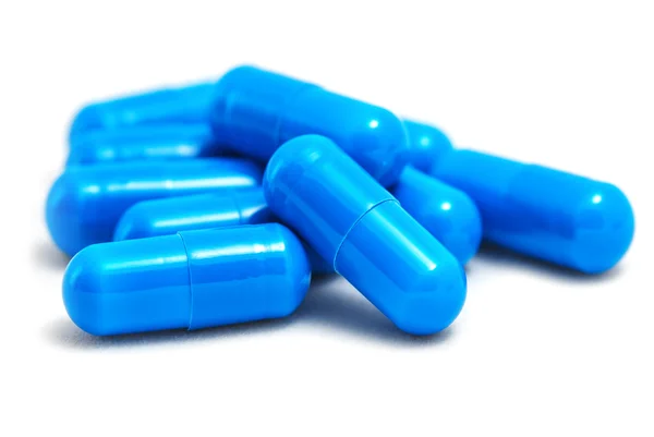 Bir sürü beyaz mavi hap.