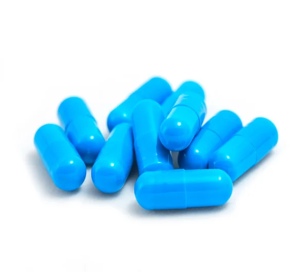 Bir sürü beyaz mavi hap.