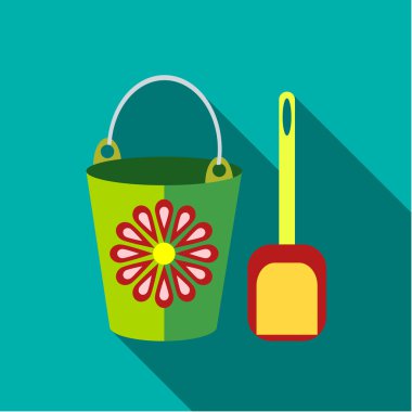 Çocuk oyuncak kova kürek mavi-yeşil arka planda ile