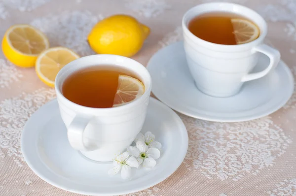 Tea with lemon in a white cup — Stock Photo, Image