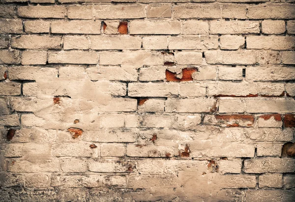 Old damaged red brick wall and white plaster as background — Stock Photo, Image