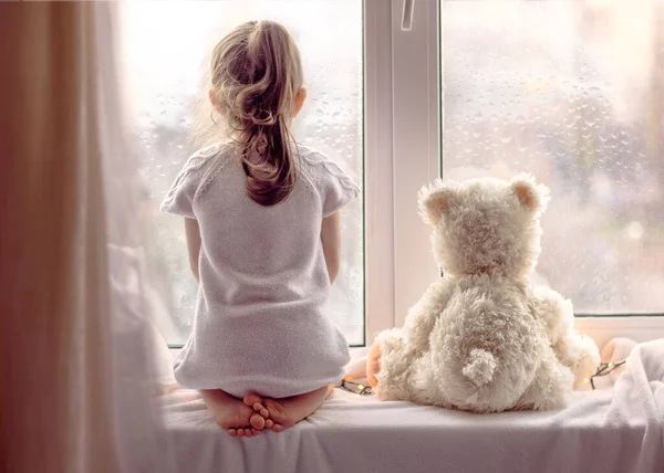 Little Girl Bear Toy Looking Window Quarantine Pandemic Concept — Stock Photo, Image