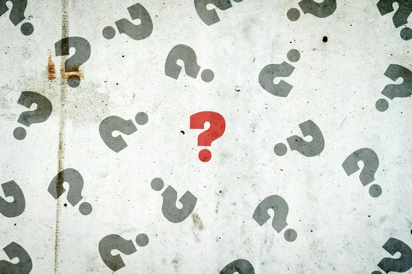 Question marks on a concrete wall. The concept of questions and answers. Business. Lifestyle. Background.