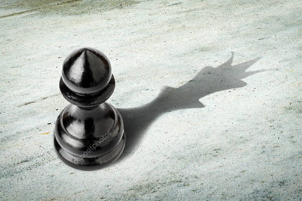 Pawn with the shadow of the queen. Motivation concept. Strength and aspirations. Confidence in your strength. Business. Lifestyle. Abstract background. Background.