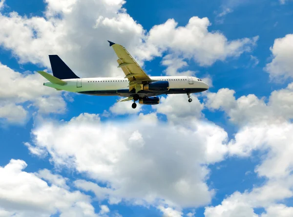 The airplane in the blue sky Stock Photo