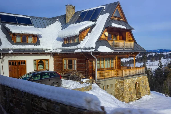 Wooden chalet in winter in Zakopane at Tatra Mountains