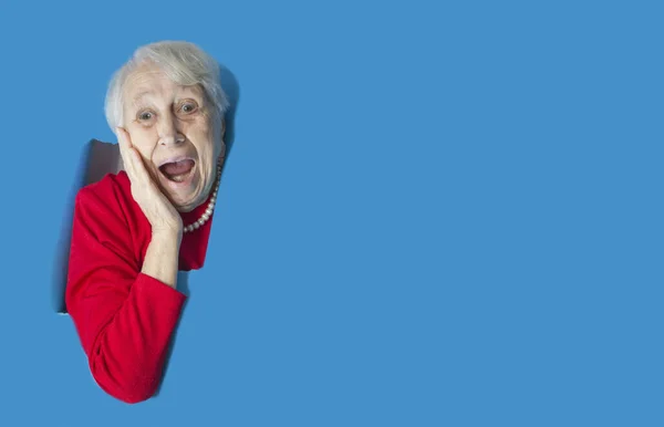 Surprised Senior Woman Looking Hole Paper Wall Shocked Lady Looks — Stock Photo, Image