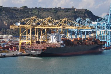 Barcelona, Spain - September 26, 2025: Cargo containers Hapag-Lloyd and others stored on the cargo ships. Hapag-Lloyd is a global leader in container shipping