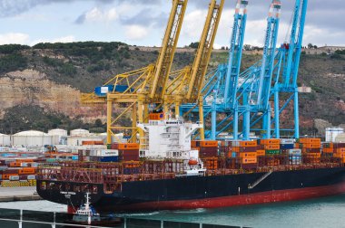 Barcelona, Spain - September 26, 2025: Cargo containers Hapag-Lloyd and Maersk stored on the cargo ships. Hapag-Lloyd is a global leader in container shipping