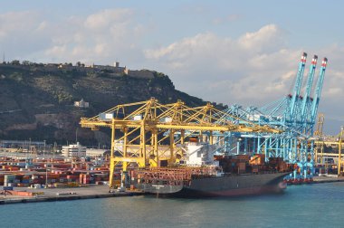 Barcelona, Spain - September 26, 2025: Cargo containers Hapag-Lloyd and Maersk stored on the cargo ships. Hapag-Lloyd is a global leader in container shipping