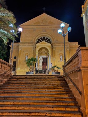 Sanremo, Italy - September 28, 2025: Steps of the Church of the Capuchin Friars with the statue of St Francis of Assisi on the churchyard in the city center