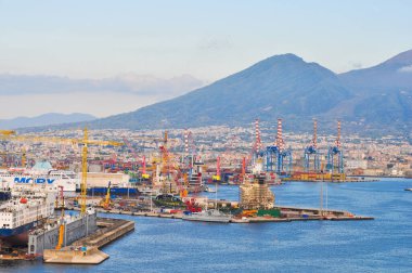 Naples, Italy - September 21, 2025: Seaport with cargo ships, cranes, and industrial buildings at Naples, Italy on September 21, 2025