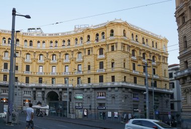 Naples, Italy - September 21, 2025: Piazza Nicola Amore, neo-Renaissance style buildings, located in the center of Umberto I street, next to Garibaldi Central Station. Facade, gate, sculpture