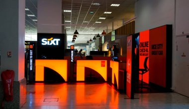 Nice, France - September 27, 2025: Sixt brand car rental agency office at Terminal 1 of international Nice airport at Nice, France on September 27, 2025