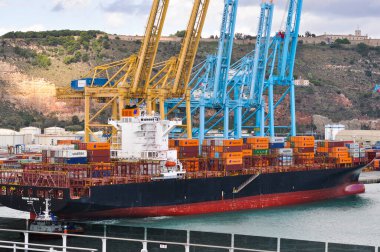 Barcelona, Spain - September 26, 2025: Cargo containers Hapag-Lloyd and Maersk stored on the cargo ships. Hapag-Lloyd is a global leader in container shipping