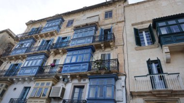 View of old building with windows, balconies in city. Republic of Malta, the picturesque city Valetta, Malta.