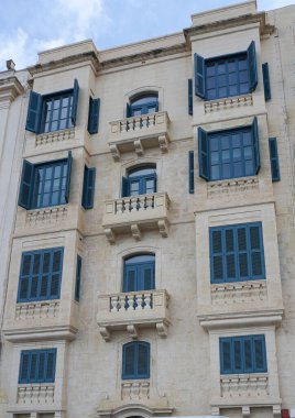 View of old building with windows, balconies in city. Republic of Malta, the picturesque city Valetta, Malta.