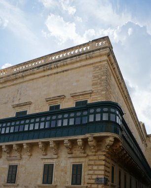 View of old building with windows, balconies in city. Republic of Malta, the picturesque city Valetta, Malta.