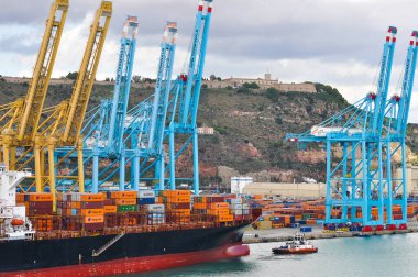 Barcelona, Spain - September 26, 2025: Cargo containers Hapag-Lloyd and Maersk stored on the cargo ships. Hapag-Lloyd is a global leader in container shipping