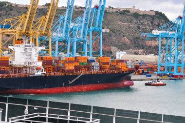 Barcelona, Spain - September 26, 2025: Cargo containers Hapag-Lloyd and Maersk stored on the cargo ships. Hapag-Lloyd is a global leader in container shipping