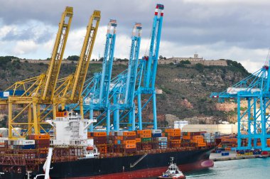 Barcelona, Spain - September 26, 2025: Cargo containers Hapag-Lloyd and Maersk stored on the cargo ships. Hapag-Lloyd is a global leader in container shipping