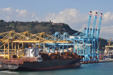 Barcelona, Spain - September 26, 2025: Cargo containers Hapag-Lloyd and others stored on the cargo ships. Hapag-Lloyd is a global leader in container shipping