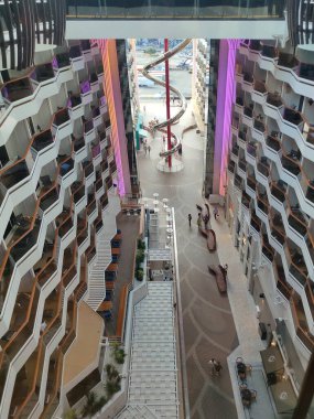Valletta, Malta - September 24, 2025: Beautiful view of deck and promenade from MSC World Europa cruise ship. Dry stainless steel spiral slide called Venom Drop The Spiral