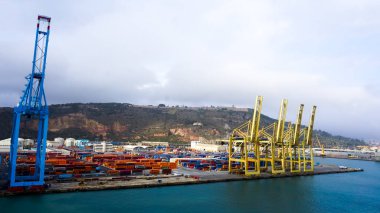 Barcelona, Spain - December 19, 2025: Cranes in the container terminal in the port of Barcelona