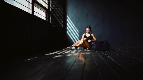 Female boxer wrapping bandages on hands — Stock Video