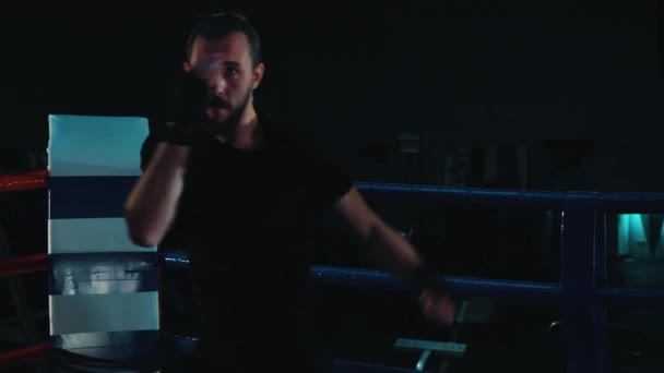 Boxer practicing punches on boxing ring — Stock Video