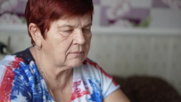 Senior woman taking pill having health problem — Stock Video