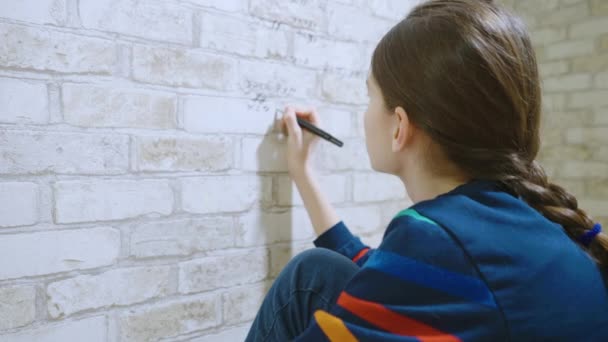 Child doing math homework on wallpaper — Stock Video