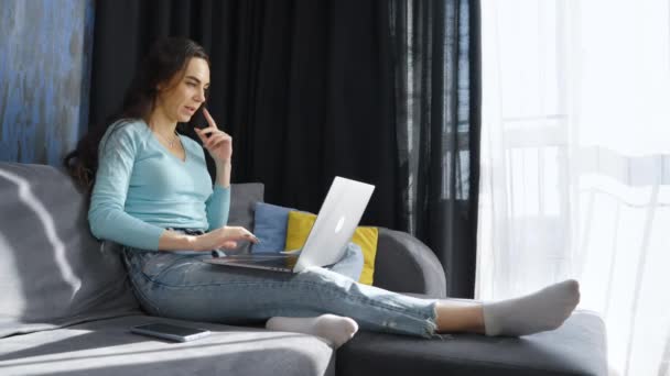 Woman sitting at home and having online meeting — Stock Video