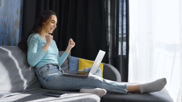 Woman having video call with family via laptop — Stock Video