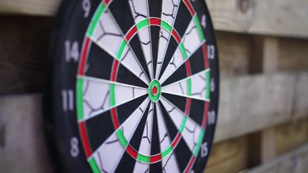 Dart arrow fails to hit the board, unsuccessful attempt. Person losing, failing — Stock Video