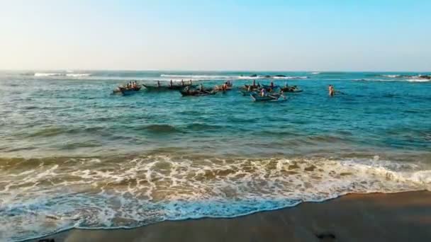 Fishermen on small boats floating in ocean, fishing to feed families, poverty — Stock Video