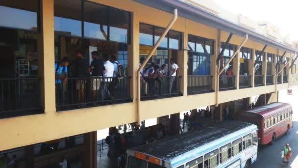 Galle, Sri Lanka - Circa February 2016: Passengers at bus station. Many people walking, waiting at busy bus station, public transportation — Stock Video