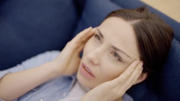 Attractive Woman Suffering Migraine Lying Sofa Symptom Stress — Stock Video