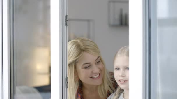 Young Mother Little Daughter Looking Out Window Waiting Dad — Stock Video