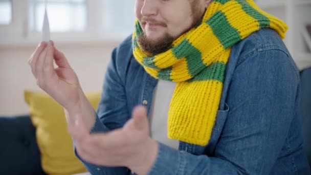 Plump Man Scarf Putting Thermometer Armpit Taking Temperature Health — Stock Video