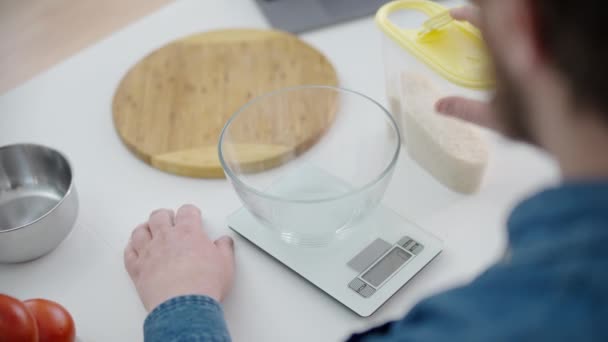 Man Measuring Portion Rice Putting Glass Bowl Kitchen Scales Cooking — Stock Video