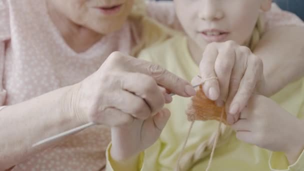 Loving Granny Teaching Little Girl Knitting Family Care Hobby Hands — стоковое видео