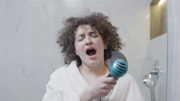 Young Sleepy Woman Drying Hair Hotel Bathroom Morning Beauty Routine — Stock Video