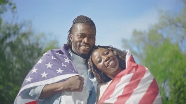 Happy Black Couple Standing Covered American Flag Park Patriotism — Stock Video