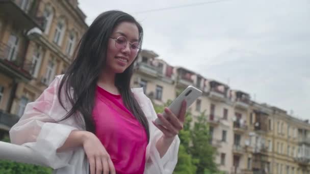 Young Asian Woman Scrolling Social Networks Smartphone Mobile Application — Stock Video