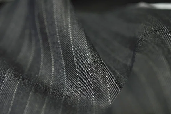 Gros plan rouleau tissu gris de costume — Photo