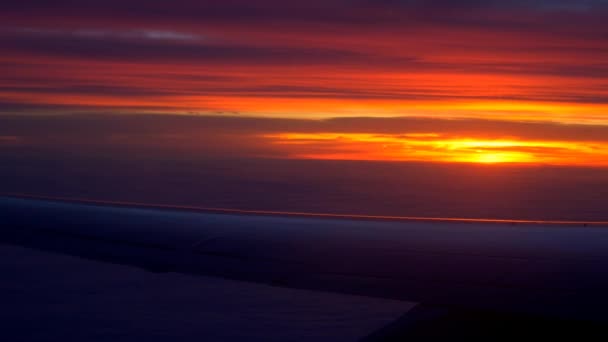 Airplane wing with sunset and clouds — Stock Video