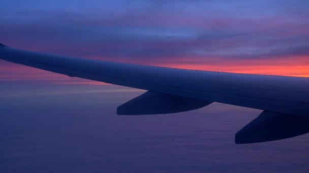 Airplane wing with sunset and clouds — Stock Video