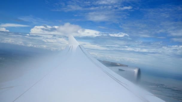 Airplane wing over clouds — Stock Video