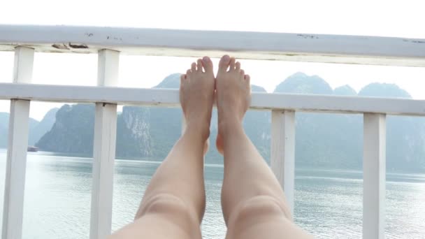 Woman legs resting on ship — Stockvideo